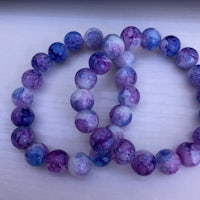 a bracelet with purple and blue beads on it