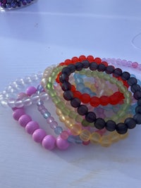 a group of bracelets laying on a table